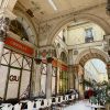 Historic Bordeaux arcade with cafes and gourmet shops walking tour