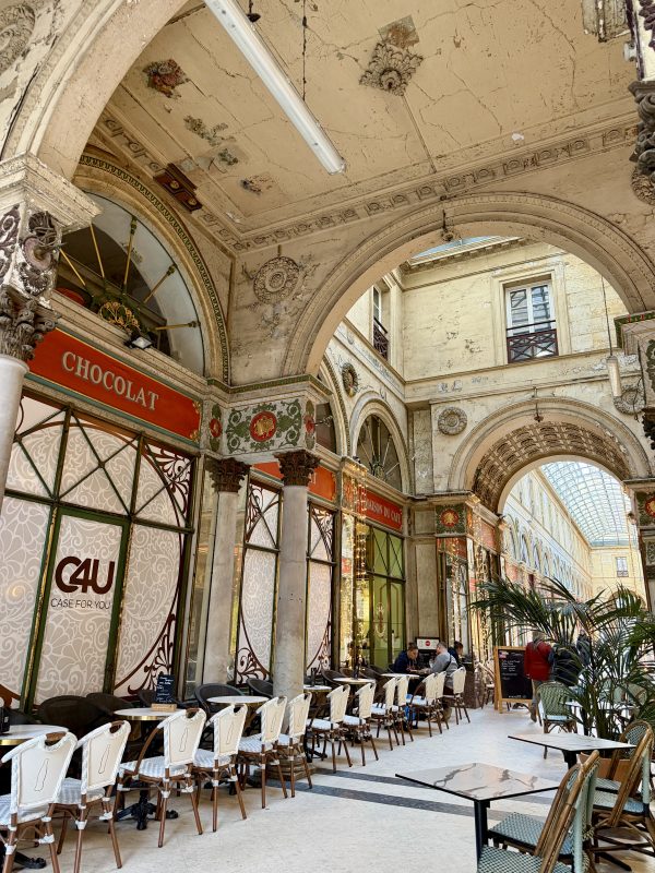 Historic Bordeaux arcade with cafes and gourmet shops walking tour